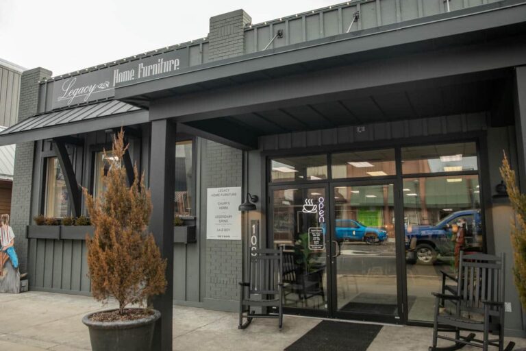 Entrance of furniture store with open sign.