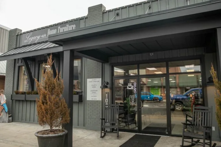 Entrance of furniture store with open sign.