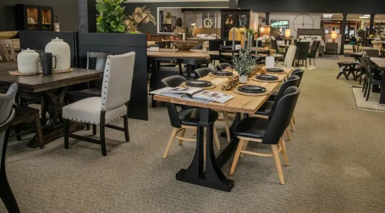 Stylish furniture showroom with dining tables and chairs.