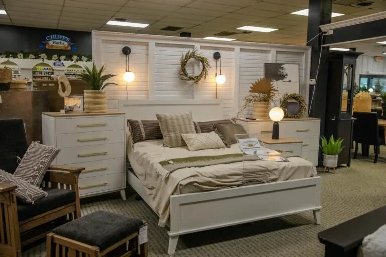 Modern bedroom furniture in cozy showroom setting.